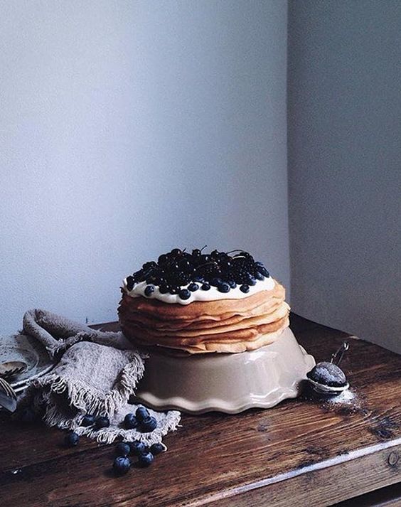 a crepe wedding cake with cream and fresh blackberries and blueberries is a cool solution for a summer wedding