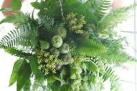 a fantastic cascading wedding bouquet of fern, seeded eucalyptus, seed pods and foliage is a stylish idea for a woodland bride