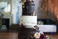 a lovely and delicious naked white and chocolate wedding cake with chocolate drip, fresh fruit and berries and bold blooms for a decadent wedding