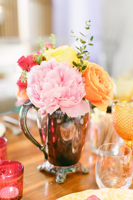 a lovely pastel bloom and greenery centerpiece in a vintage jug is a stylish idea for a garden bridal shower