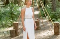 a minimalist halter neckline wedding dress with an embellished belt and dark green suede shoes for a woodland wedding