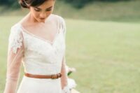 a modest and cute wedding dress with illusion sleeves and an amber leather belt for a rustic touch
