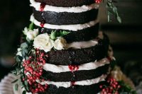a naked chocolate wedding cake with berry drip, fresh berries, greenery and pastel blooms is a fantastic summer wedding dessert
