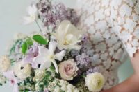 a pastel wedding bouquet with lots of lilac and pale pink blooms, neutral and blush ones and greenery is a fantastic and lush idea for a spring bride