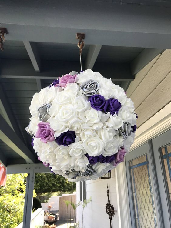 a pretty purple, pink, white and grey rose pinata as a creative and cool wedding guest book is a lovely solution for a romantic wedding