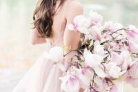 a super romantic and chic pink one flower wedding bouquet is a gorgeous solution for a spring bride