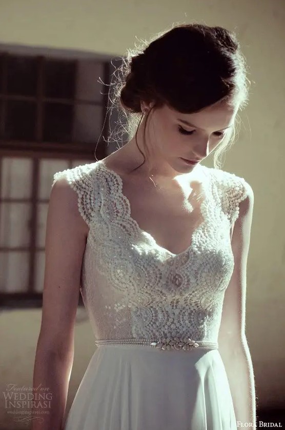 a very delicate bead and pearl bridal sash that matches the bodice detailing creates a more chic look