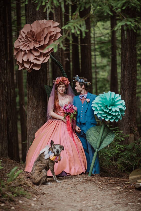 an oversized mauve and turquoise paper bloom are great to style a fairy tale like wedding
