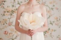 an oversized neutral paper bloom is a beautiful solution for a wedding, it can be rocked instead of a wedding bouquet or as decor