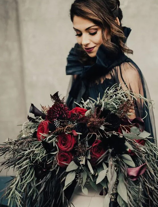 deep red and black callas wedding bouquet with cascading greenery of various kinds