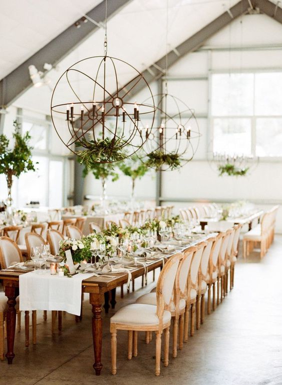 fantastic sphere candle-inspired chandeliers with greenery are amazing to give light to the space and add to its decor