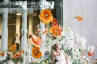 gorgeous oversized orange bloom decor and lots of pastel flowers and greenery are amazing to style your spring or summer wedding
