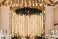 string light canopies and candles on the floor are a great combo for a barn ceremony space and for the reception, too