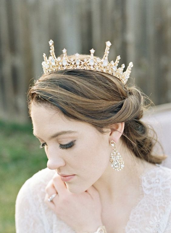 a beautiful gold and crystal wedding crown paired with matching chandelier earrings will make your bridal look ultimate