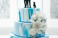 a cute blue marble wedding cake
