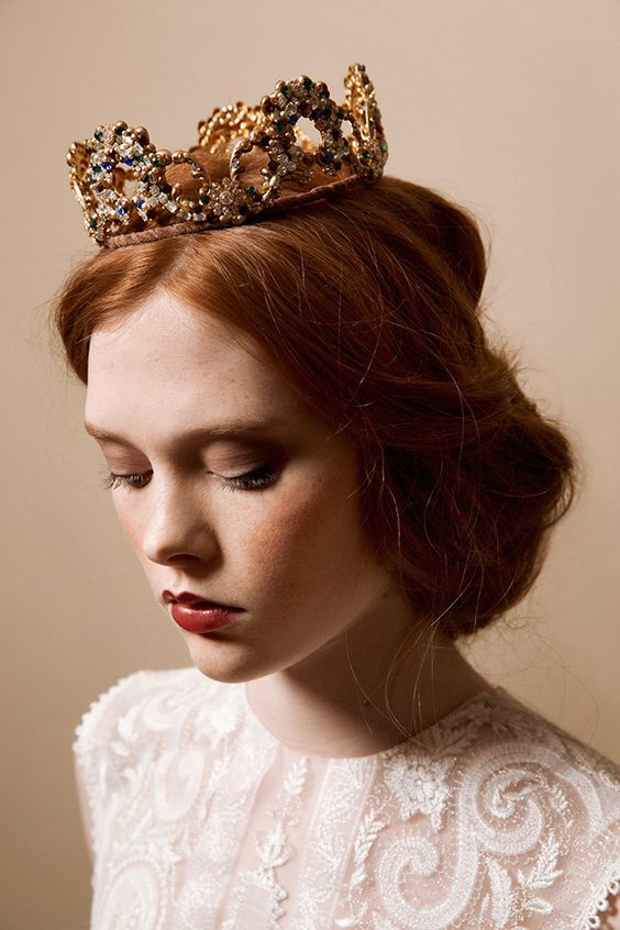 a bold and catchy embellished bridal crown won't be too heavy to wear and will add a fairy-tale feel to your look