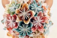 a bold paper wedding bouquet of colorful paper blooms is a very creative and eco-friendly idea, reuse some paper you have at hand