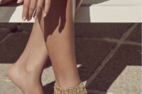 a catchy gold bead tiered ankle is a stylish idea for a boho bride who wants to add a touch of gypsy