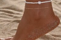 a dainty chain anklet and a white bead and pearl one are a lovely combo for a boho bridal look