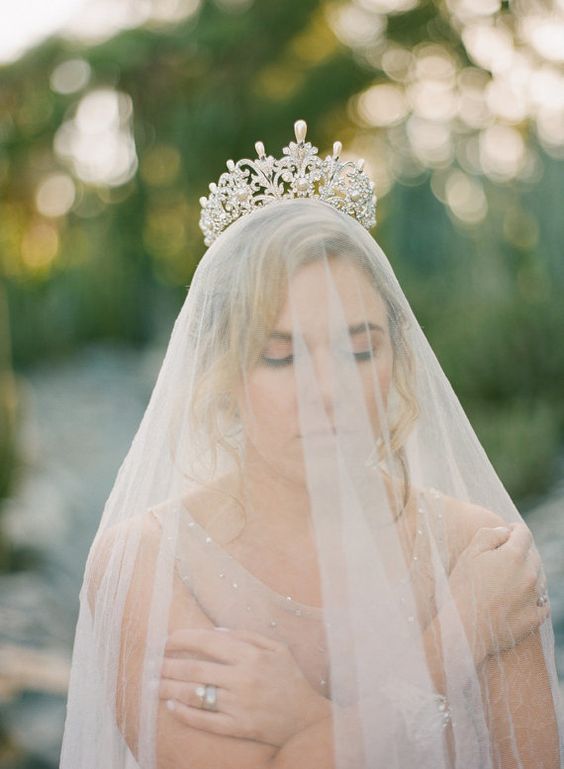 a fantastic bridal crown with pearls and crystals is a bold idea, especially if you par it up with a veil