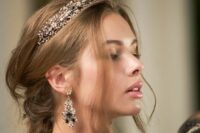 a fantastic gold embellished crown with black and white rhinestones and a pair of matching earrings for a refined bridal look