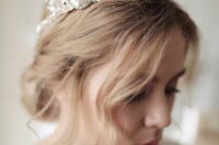 a fantastic large rhinestone and crystal bridal crown will make a super bold and glam statement in your look