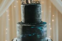 a galaxy wedding cake with Han Solo and Leia silhouettes and their phrases for a Star Wars wedding
