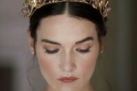 a gold flower and pearl bridal crown is a gorgeous idea for a wedding, ti will add a glam feel to the look instantly