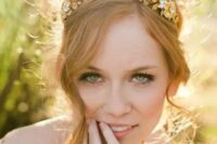 a gorgeous and shiny gold flower and leaf crown with rhinestones is a lovely solution for a summer or fall bride, such a crown won’t wither