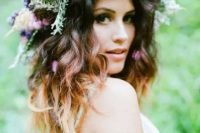 a lush floral crown with wildflowers, herbs and berries for a wild summer boho bride