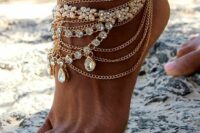 a statement boho beach anklet with layered gold chains, large rhinestones and rhinestone flowers is amazing