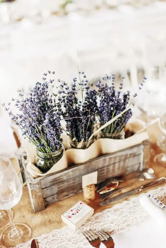 a wooden crate with lavender in jars fits not only a Provence wedding, it can be used for a rustic summer wedding, too