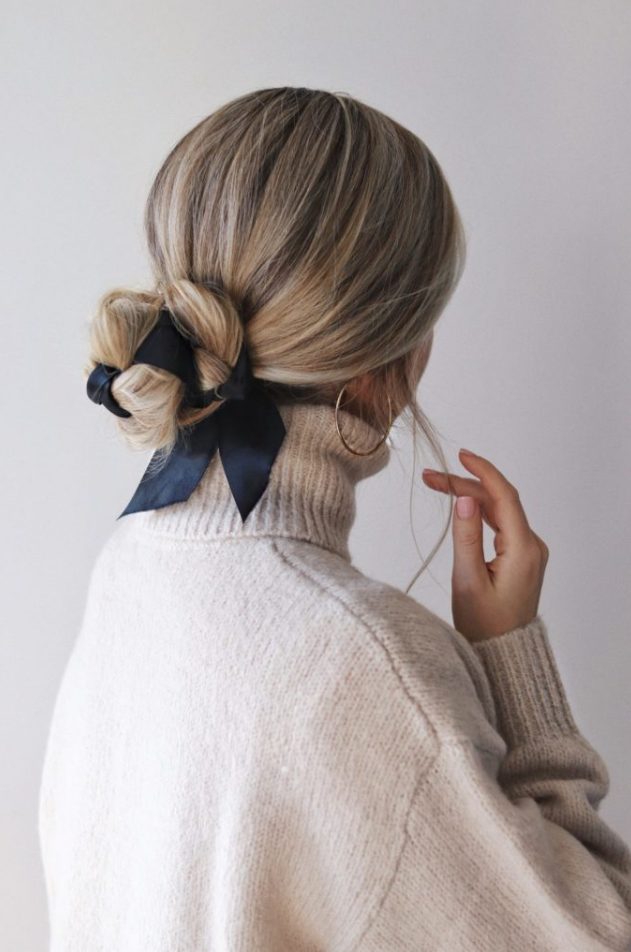 an elegant low bun interwoven with a black ribbon is a very chic idea, suitable for many bridal styles