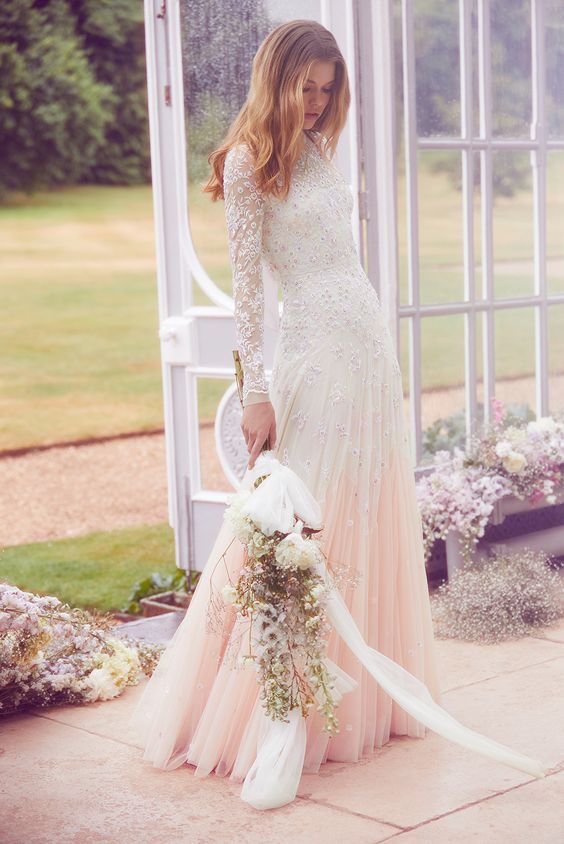 an embellished A-line wedding dress with a dip dye pleated pink skirt and long sleeves is very beautiful