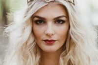 an eye-catchy gold bridal crown is a great idea to pull off a queen-like look