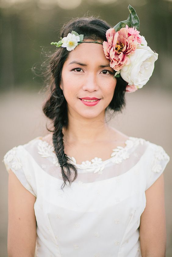 an oversized fabric flower headpiece in pink and white, with faux greenery for a boho wedding in summer