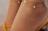 dainty gold chain and rhinestone anklets with pendants and without will add a girlish feel to the look