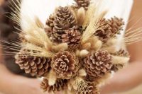 pinecones and wheat are a non-traditional solution for a bride and is a nice solution for a fall to winter wedding