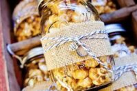 popcorn in jars, with burlap and twine is always a great idea of an eco-friendly wedding favor that is always to the point
