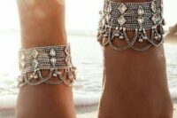 statement multi-layered bead row anklets with large rhinestones, additional chains and small bells plus toe rings