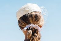 wearing a ribbon in your hair on your wedding day, doesn’t have to mean skipping other accessories, a wedding hat or veil