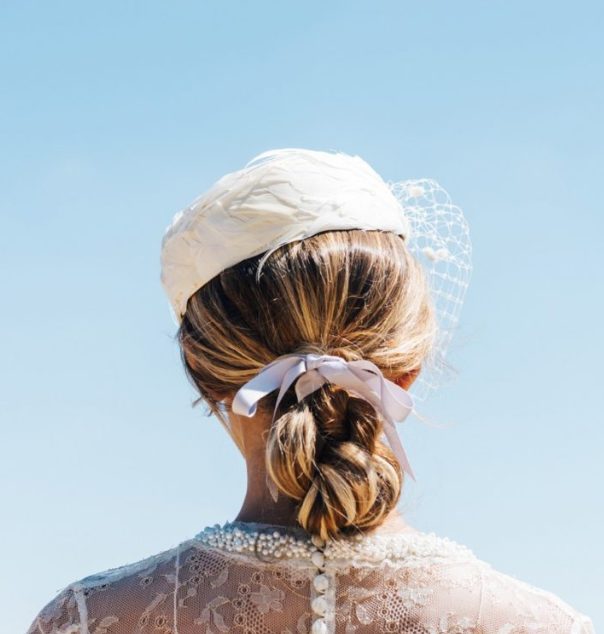 wearing a ribbon in your hair on your wedding day, doesn't have to mean skipping other accessories, a wedding hat or veil