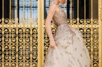 a beautiful wedding ballgown with a fully embellished bodice, no sleeves and partly embellished skirt with a train for a formal wedding