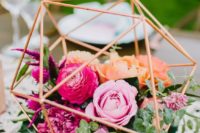 a cool geometric centerpiece for a wedding reception table