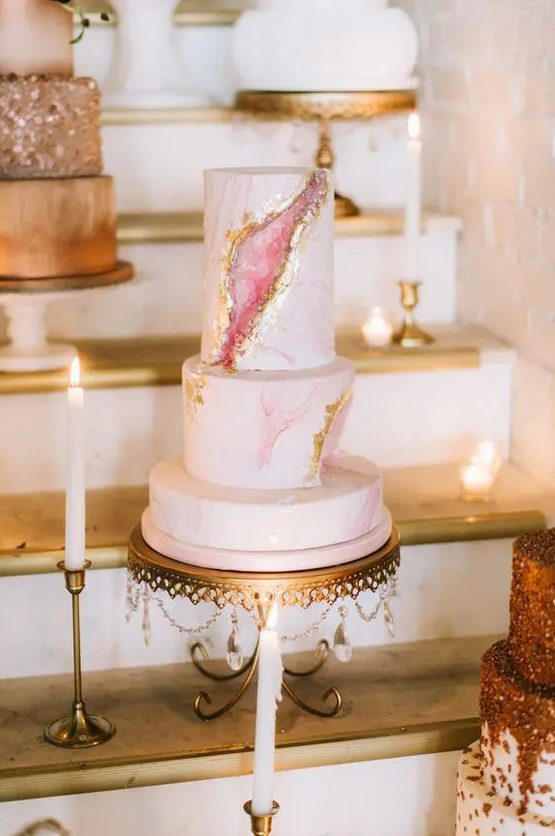 a chic pink marble and rose quartz wedding cake with gold leaf will make your guests wow