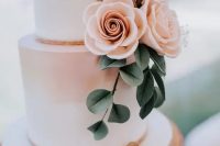 an ombre wedding cake with flowers