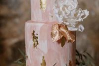 a lovely marble wedding cake in shades of pink