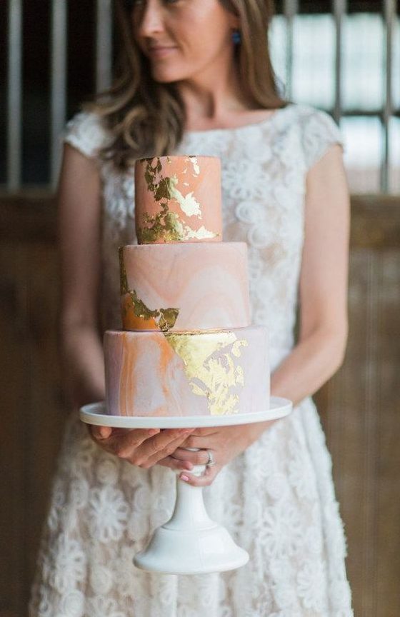 a pink marble wedding cake with gold leaf is a pretty glam idea for a romantic wedding done in pastels