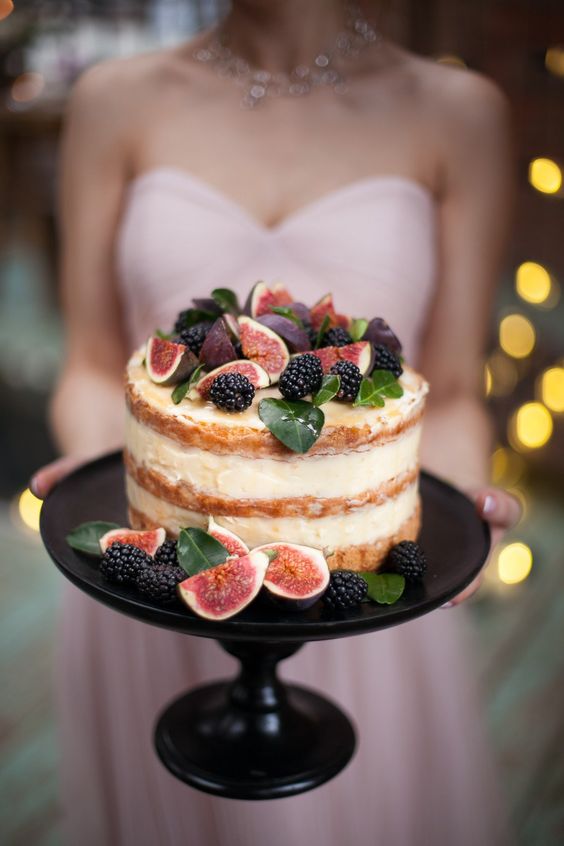 a pretty summer wedding cake with drip, blackberries, figs and foliage is a gorgeous idea for a summer wedding