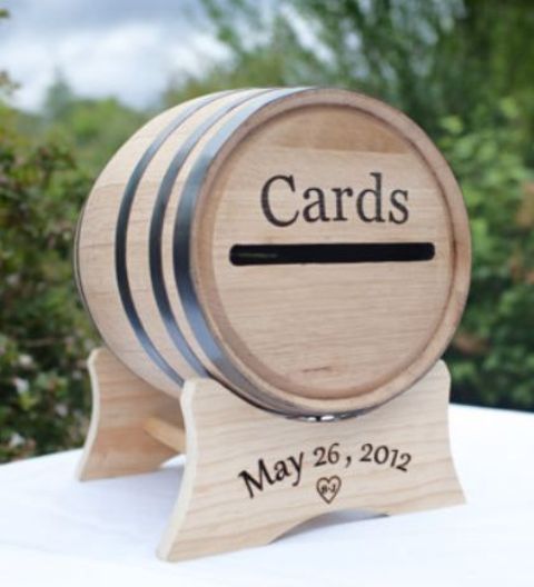 a small wine barrel with stenciling is a great alternative to a wedding card box and will match a vineyard wedding
